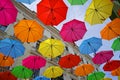 Street umbrellas over blue sky