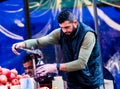 Street vendor selling pomegranate juice