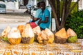 Street vendor of coconuts. Stone Town, old colonial center of Zanzibar City, Unguja island, Tanzania.