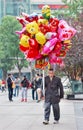 Street vendor with colorful balloons, Chongqing, China