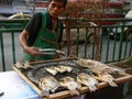Street Vendor Cooking Fish in Bangkok Thailand