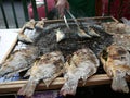 Street Vendor Cooking Fish on the Streets of Bangkok Thailand