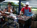 Street Vendor Cooking Meat on the Streets of Bangkok Thailand