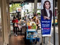 Street vendor and customer with face masks outside the Phrom Pong Skytrain station on Sukhumvit Road in Bangkok, Thailand