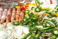 Street vendor grill with hot dogs and veggies Royalty Free Stock Photo