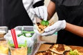 Street vendor hands making taco outdoors Royalty Free Stock Photo