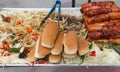 Street vendor with hot dogs and grilled onions Royalty Free Stock Photo