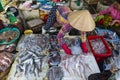 Street Vendor in Hue, Vietnam traditional fish market people selling fresh fish on the sidewalk. Royalty Free Stock Photo