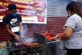 Street vendor sell assorted grilled pork and chicken innards barbecue at his makeshift food stall Royalty Free Stock Photo