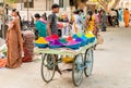 Street vendor sell colorful tika powders at street market of Puttaparthi, India