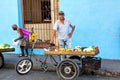 Street vendor selling fruit and vegetables on his bike in the streets of Camaguey, Cuba Royalty Free Stock Photo