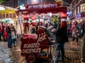 Street vendor selling hot chestnuts at the Christmas Market in the city of York, UK