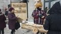 Street vendor selling maple toffee made of hot maple syrup in Quebec, Canada.