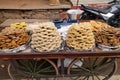 A street vendor selling sweets outside the Jagatpita Brahma Mandir Rama temple in Pushkar, India