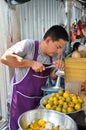 Street vendor sells fresh orange juice