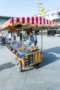 A street vendor sells pretzels
