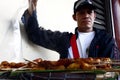 Street vendor showing deep fried sweet snacks