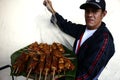 Street vendor showing deep fried sweet snacks