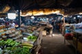 Street vendor and stall full of fresh produce and fruit at night
