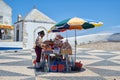 The street vendor in the traditional costume on the square of Na