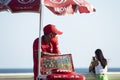 Street vendor waiting for a customer to buy his products.