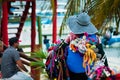 Street vendor woman selling colorful traditional handmade souvenirs