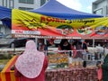 Street vendors and hawkers sell local goods and food to the public on-street by opened a small stall.