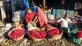 Street vendors selling colorful roses and flowers in baskets in the ancient Mullick