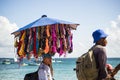 Street vendors walk on the sand of Porto da Barra beach