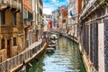 Street in Venice with canal boat