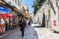 Street view of Al-Wad street in the old city of Jerusalem, Israel with Orthodox Jewish walking in the street