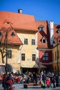 Street view with ancient houses and beautiful cafe terrace