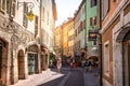 Street view of Annecy old town with tourists colourful historical buildings and beautiful bright light in Annecy France