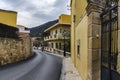 Street view of Archanes town with the old colorful traditional houses. The mountain Juktas which is said to resemble the face of Royalty Free Stock Photo