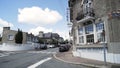 Street view of a beautiful european city with many cars parked along the road. Action. Beautiful hotel, brick building Royalty Free Stock Photo