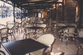 Street view of a Cafe terrace with empty tables and chairs Royalty Free Stock Photo