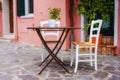 Street view of a cafe terrace with empty tables and chairs, Royalty Free Stock Photo