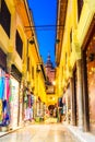 Street view with Cathedral of the Incarnation main tower, Granada,Andalusia, Spain