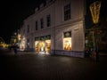 Street view with a Cheese store in Deventer city at night in the Netherlands
