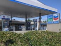 Street view of a Chevron fuel pump station on a sunny day