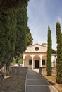 Street view on the church and Cypress trees.