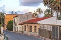 Street view, colored houses and palm trees in Murcia,Spain.