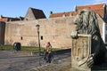 Street view with female biker and city wall, Elburg Royalty Free Stock Photo