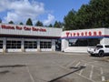 Street view of a Firestone Complete Auto Care Center on a sunny day Royalty Free Stock Photo