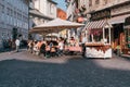 Street view in Ljubljana city center, small outdoor cafe with tourists in Ljubljana, Slovenia