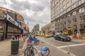 Street view in Manhattan with citi bike rental parking.