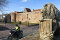 Street view with motor rider and city wall, Elburg