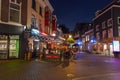 Street view at night and people eating, drinking outdoor in Utrecht, Netherlands Royalty Free Stock Photo