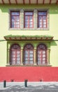 Street view of an old colonial building facade, Cuenca, Ecuador Royalty Free Stock Photo