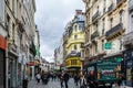 Street view of old downtown with lots of people walking at the street of Brussels, Belgium